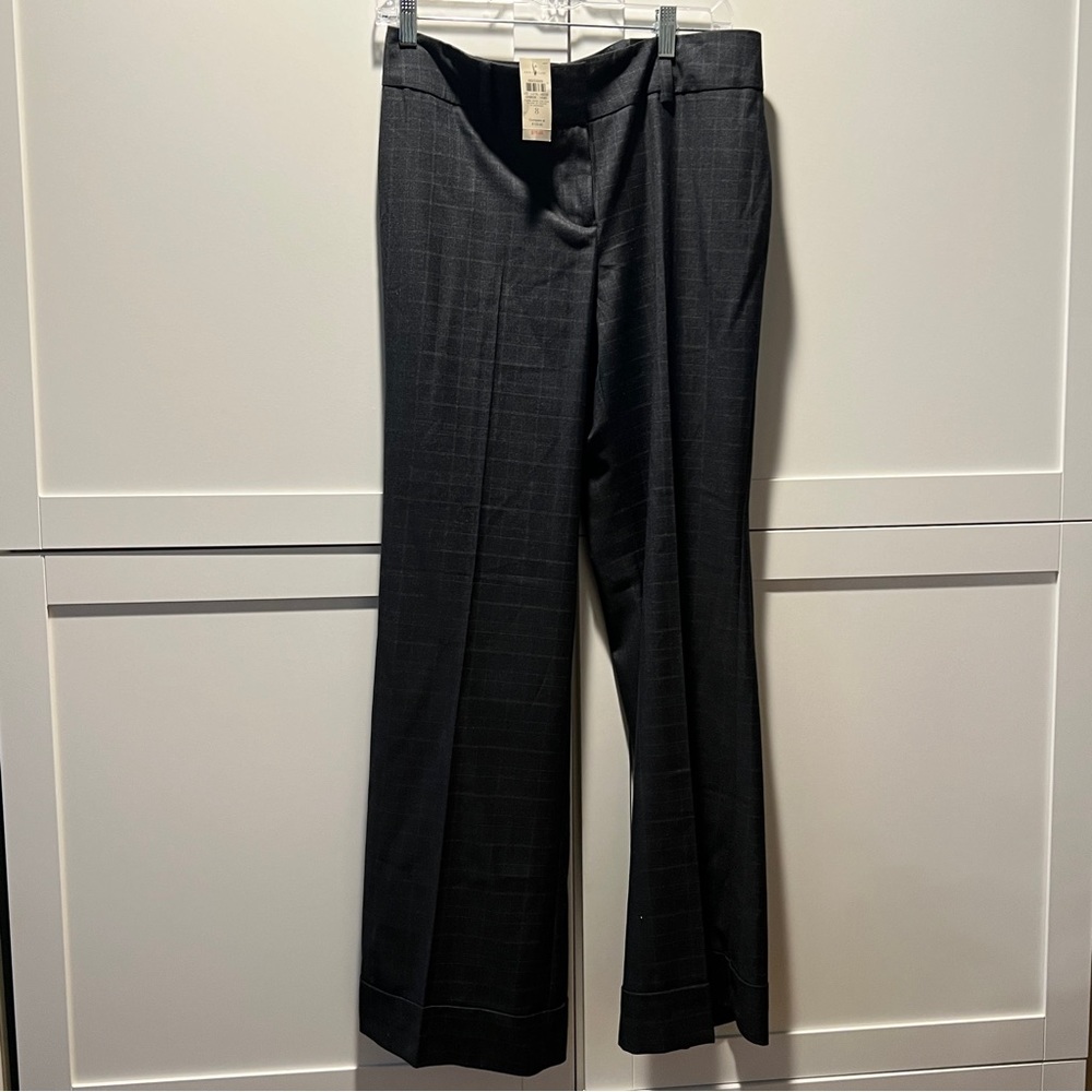 AT, size 8, gray with white lined details.